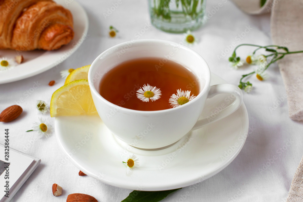 Still life with herbal tea and daisies. French breakfast, provence style, pleasure time. Close up. Still life with herbal tea and daisies. French breakfast, provence style, pleasure time. Close up.