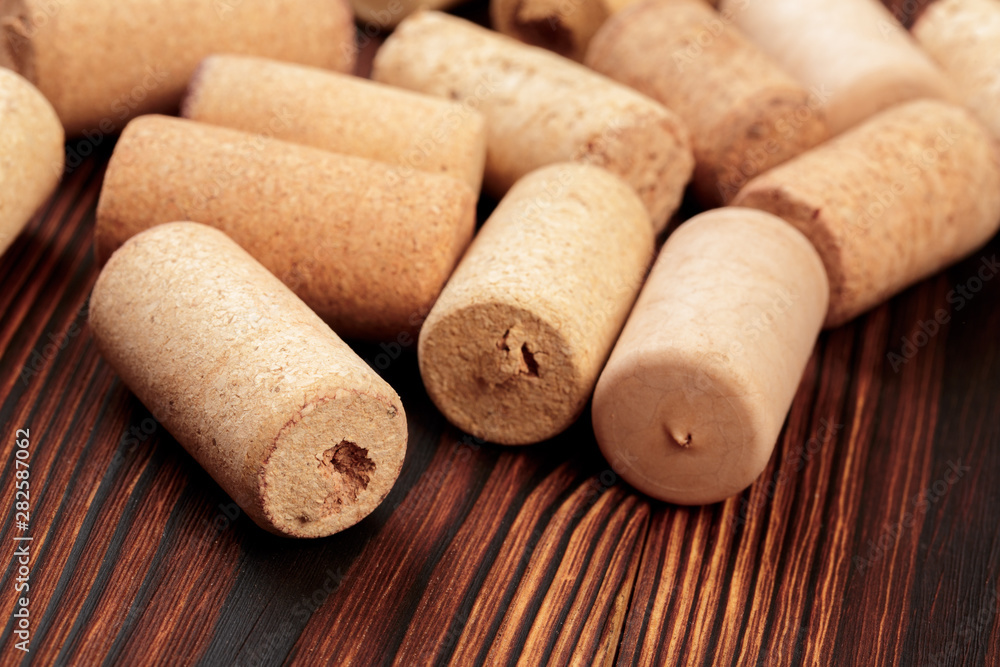 wine corks on a dark wooden background texture with a place for text.  - Image