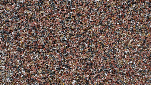 texture closeup of colorful sand wall stones