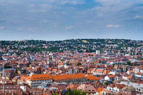 Germany, Skyline of city stuttgart in valley surrounded by hills covered by trees