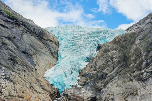 Briksdalsbreen glacier with melting blue ice photo