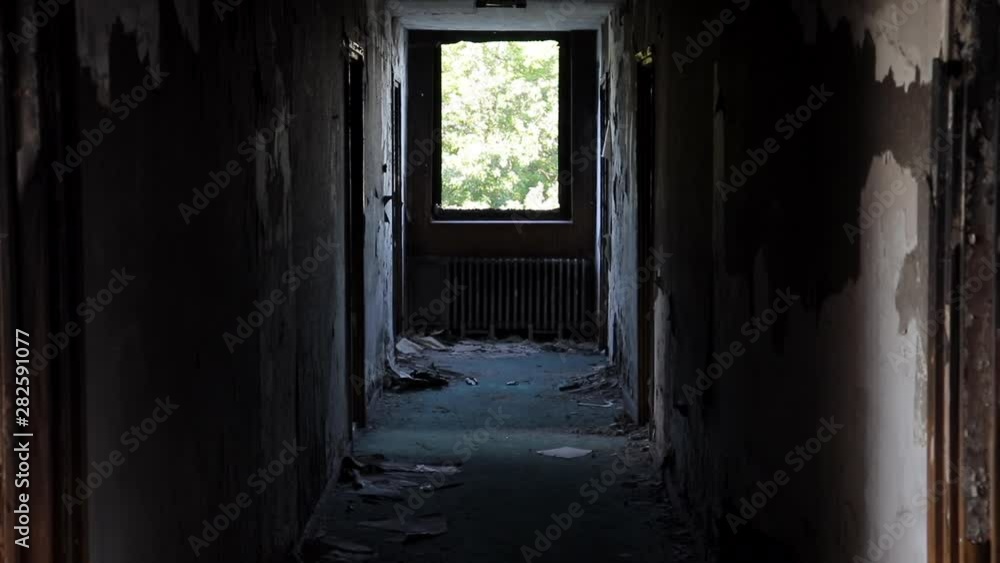 Dolly In Down Hallway Of Abandoned Hotel In Disrepair. Urban Exploration. Dolly In Down Hallway Of Abandoned Hotel In Disrepair. Urban Exploration.