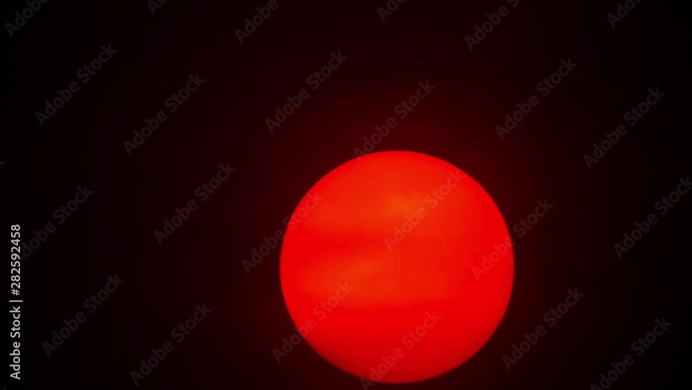 Red sun sphere in thick smog Red sun sphere in thick smog