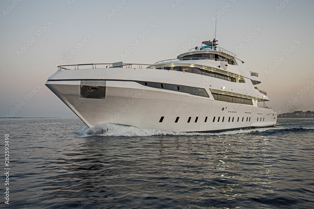 Luxury private motor yacht sailing at sea