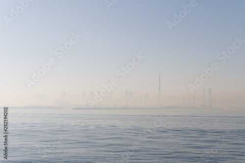 Photography Skyline of Dubai at sunrise seen from the sea