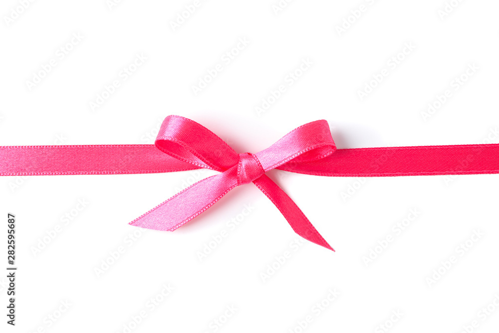 Pink ribbon with bow isolated on white background. Gift concept Pink ribbon with bow isolated on white background. Gift concept