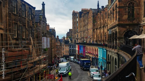 Time lapse view of colourful Victoria street in Edinburgh old town photo