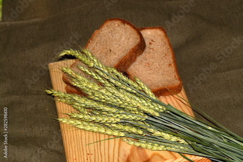 sliced bread and wheat ears