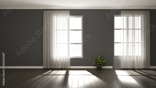 Stylish empty room with panoramic windows, parquet wooden floor, classic shutters, potted plants and decors. Gray background with copy space, interior design concept idea
