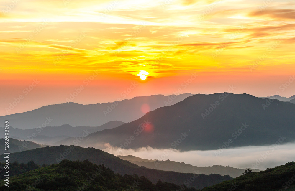 A landscape view of beautiful sunrise and sea of clouds at Anbandeogi of Gangneung in the Alpine cabbage field, South Korea.