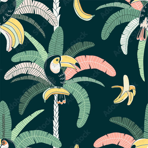 Toucan vector color seamless pattern. Jungle flora and fauna background. Fruit eating bird. Rainforest palm and banana. Exotic bird. Decorative tropical textile, wallpaper, wrapping paper design