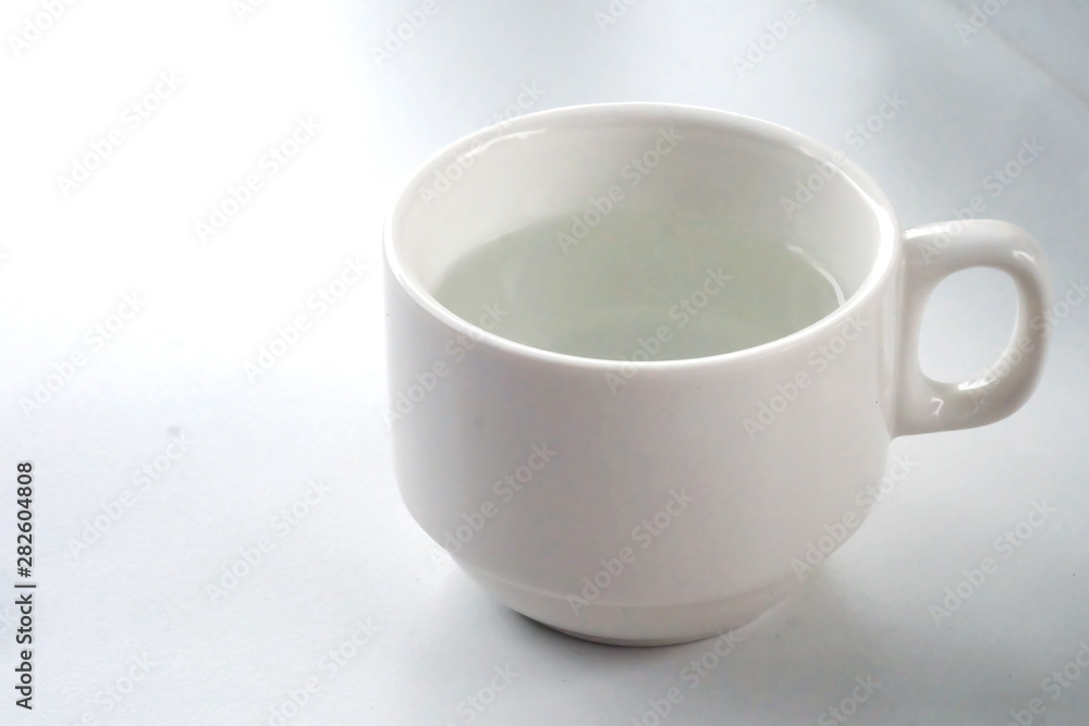 warm water in white cup and space for write wording warm water in white cup and space for write wording