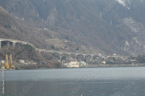  Panoramic view on Geneva Lake. Mountains, hills, greenery and blue sky. Montreaux, Switzerland. 