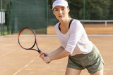 Front view woman playing tennis