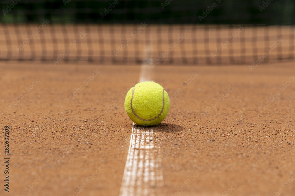 Front view tennis ball on court ground