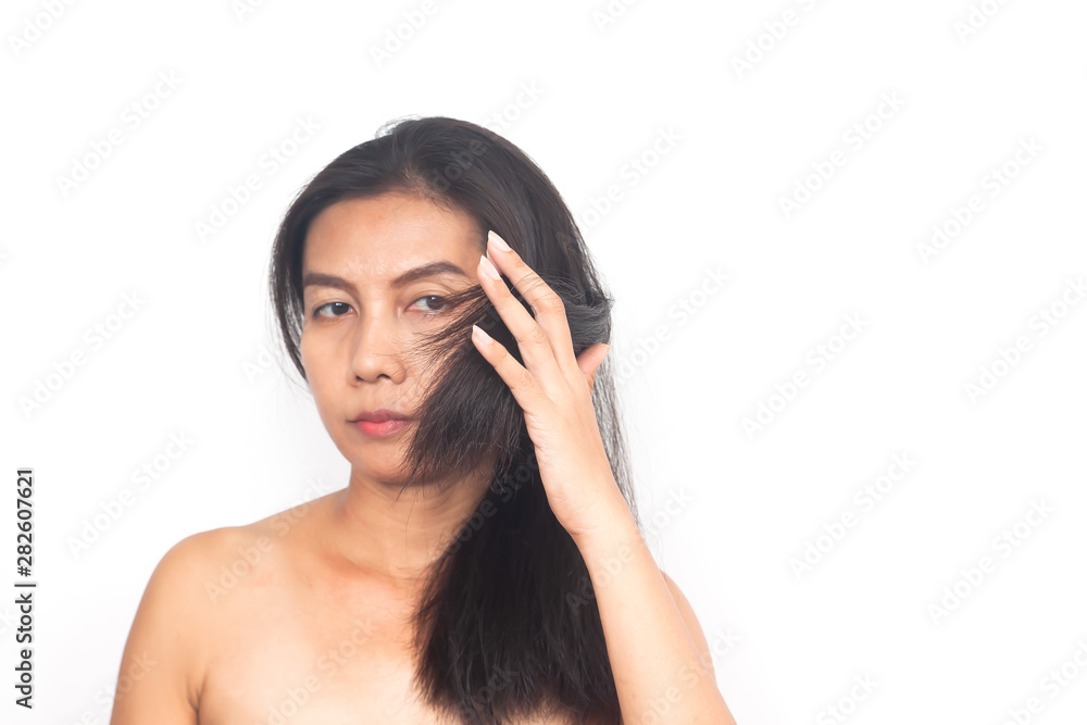 Age 40+ Asian woman with problem about long hair on white background. Health and surgery concept Age 40+ Asian woman with problem about long hair on white background. Health and surgery concept