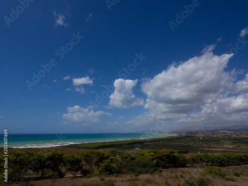 Coastal scene  Sicily  showing littoral vegetation and clouds forming over the coast
