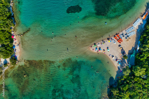 Aerial drone bird's eye view of Bella Vraka Beach with turquoise sea in complex islands in Sivota area, Ionian sea, Epirus, Greece