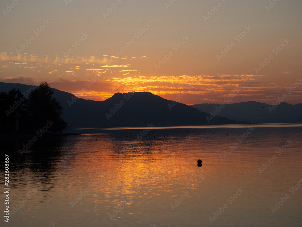 Sunset at Lago d'Iseo or Lake Iseo, Italian Lakes area, showing peaceful setting and location