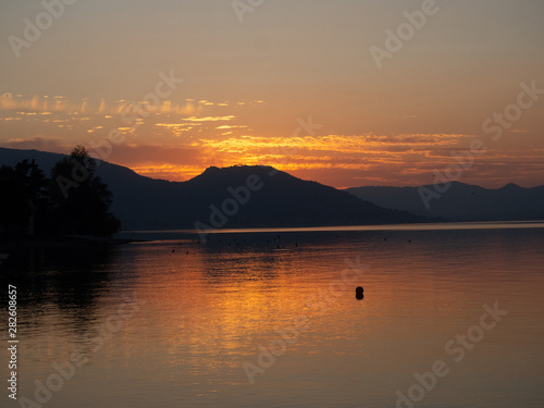 Sunset at Lago d'Iseo or Lake Iseo, Italian Lakes area, showing peaceful setting and location