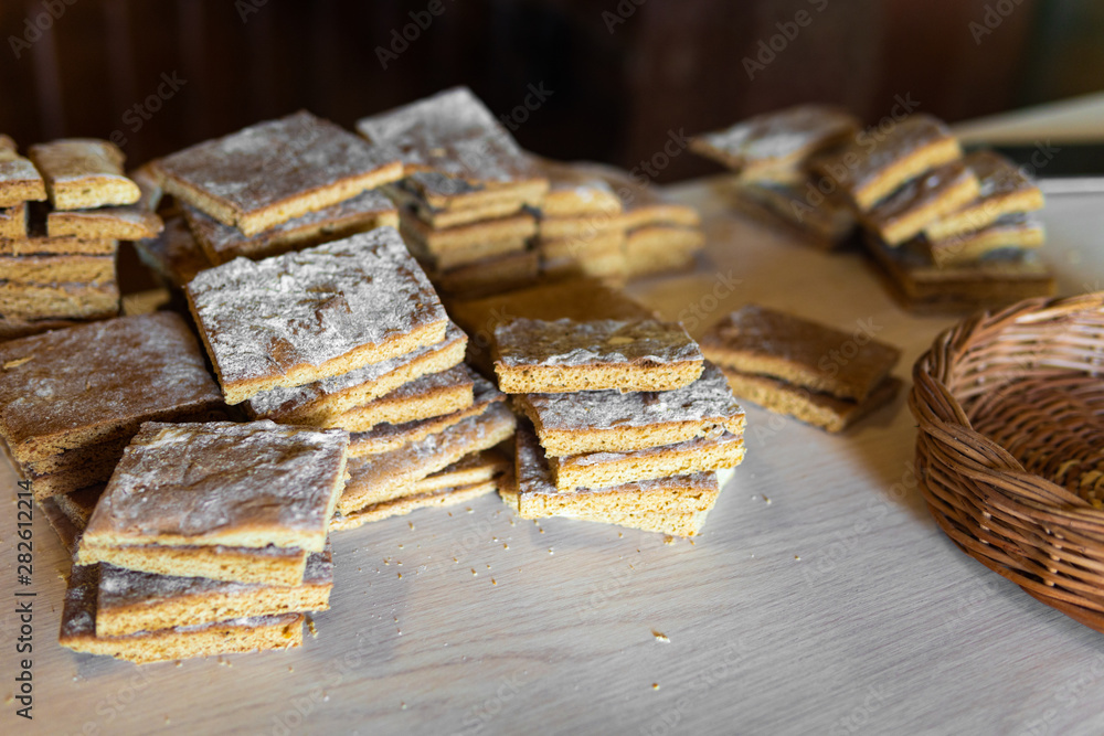 crunchy bread on a wooden background in rustic style, next to the basket. crunchy bread on a wooden background in rustic style, next to the basket.