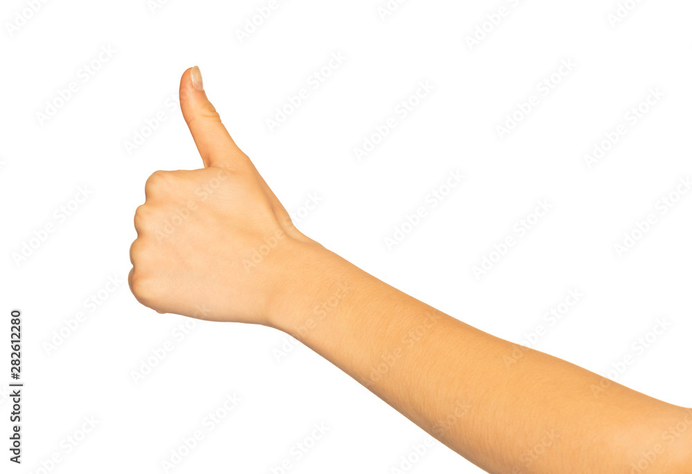 Female hand giving thumbs up gesture on white Female hand giving thumbs up gesture on white