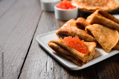 фотографія Russian pancakes blini with red caviar