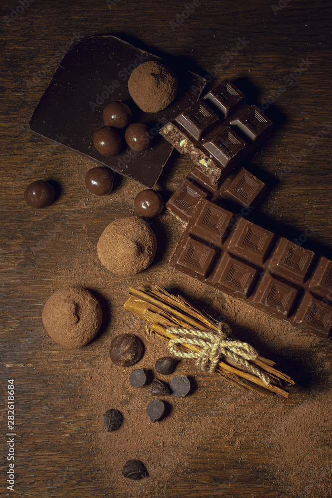 Chocolate and truffles on wooden background Chocolate and truffles on wooden background