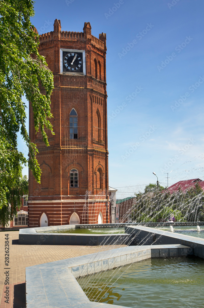 Fototapeta premium City Clock tower (Yelets Chimes) and Victory fountain in Yelets. Russia