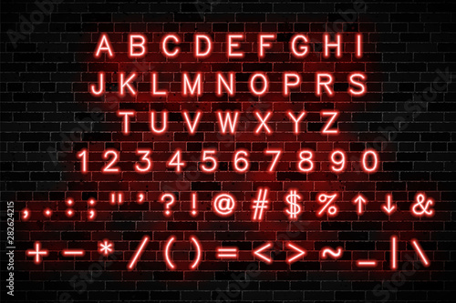 red neon signs capital letters, numbers and symbols on dark brick wall background. modern vector alphabet easy to edit and customize. eps 10