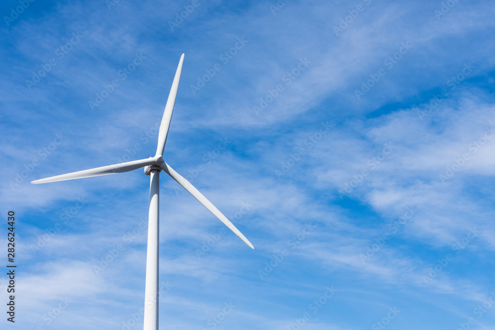 wind turbine over mountains and blue sky wind turbine over mountains and blue sky