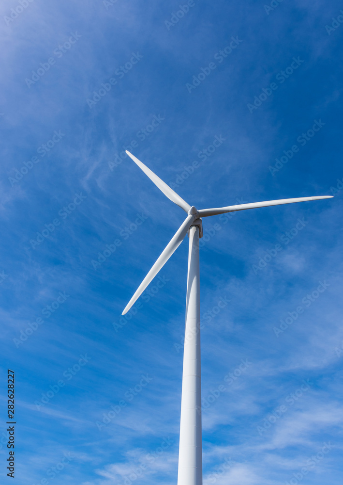 wind turbine over mountains and blue sky wind turbine over mountains and blue sky