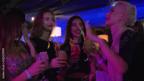 Wallpaper Mural celebrate in a nightclub, young sexy females friends in fashionable clothes have fun at girls party drinking alcohol cocktails Torontodigital.ca