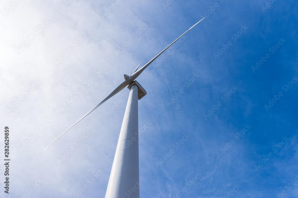 wind turbine over mountains and blue sky wind turbine over mountains and blue sky