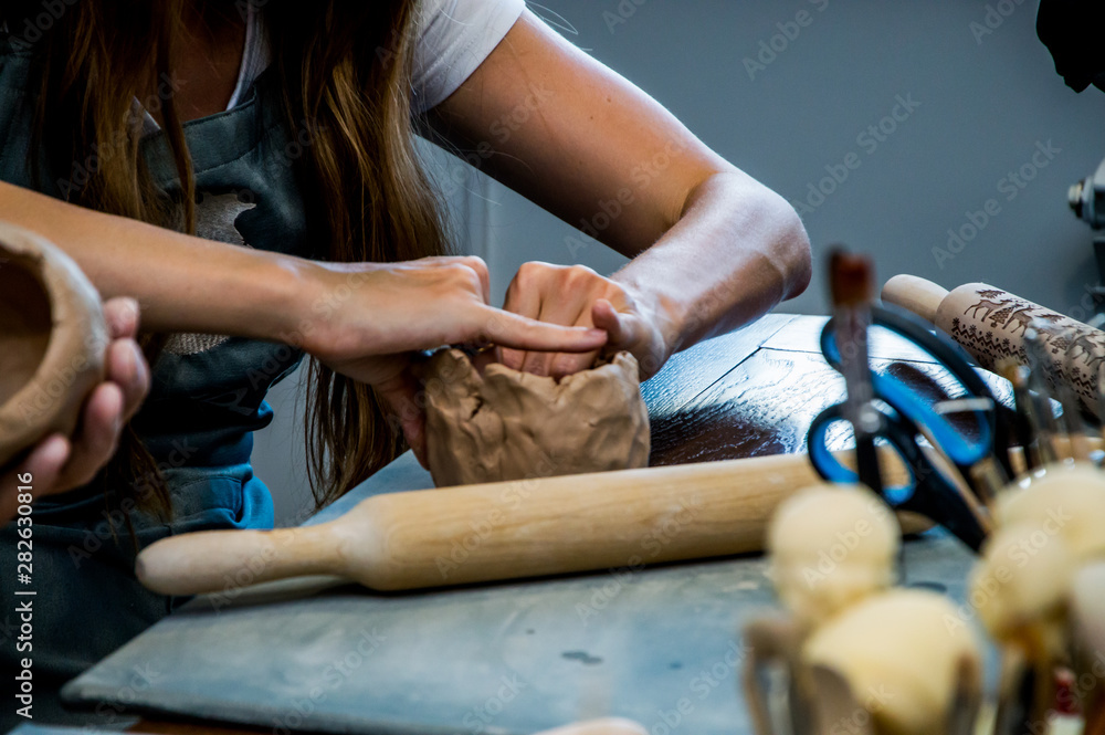 rolling clay on the board