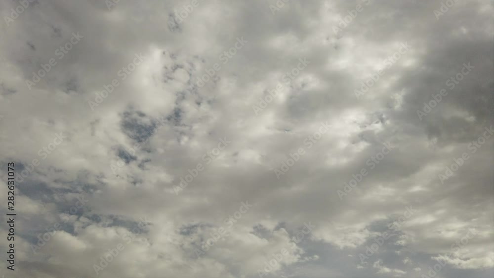 Scenic cloudy sky timelapse with sunbeams and back lit with cirrus cumulus clouds moving fast in the air Scenic cloudy sky timelapse with sunbeams and back lit with cirrus cumulus clouds moving fast in the air