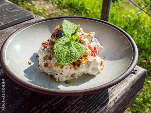 whipped cream with berry s and oatmeal, delicious dessert photo