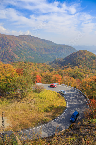 Road along the mountain with leaves turning color - Nikko, Japan