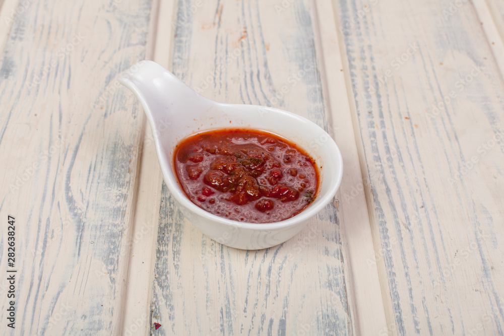 Obraz na plátně beautiful and juicy sauce seasoning for various dishes on a wooden substrate, fo