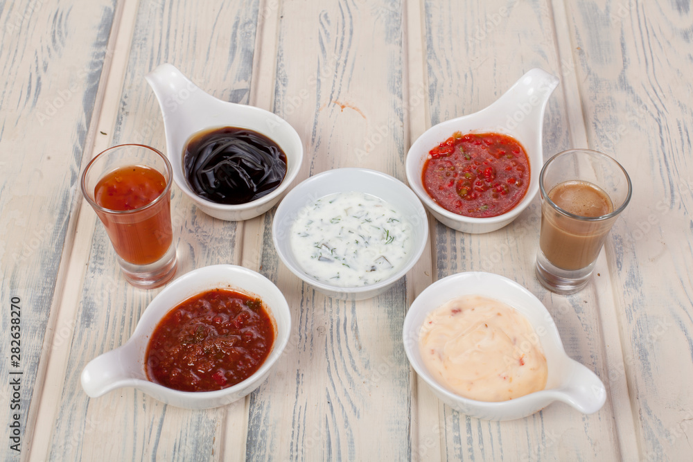 beautiful and juicy sauce seasoning for various dishes on a wooden substrate, for decoration in food design and cooking beautiful and juicy sauce seasoning for various dishes on a wooden substrate, for decoration in food design and cooking