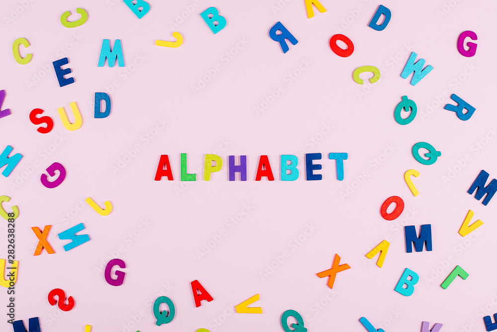 Bright multicolored alphabet background with word 
