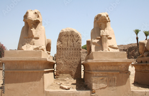 Ram statues at entrance of temple Karnak , old egypt