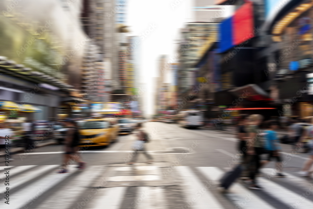 Blurred people crossing the street