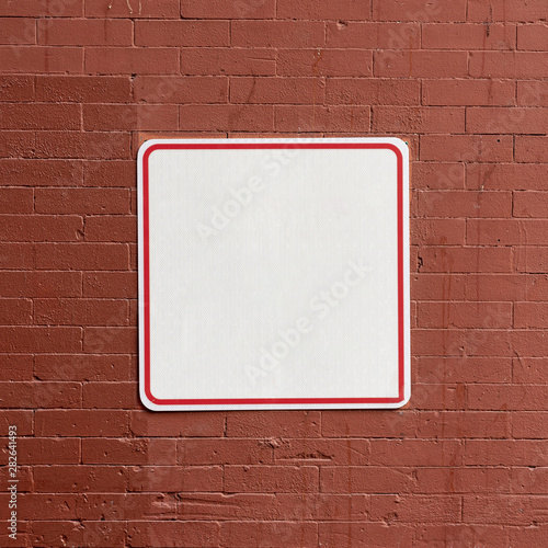 Street sign on brick building copy space