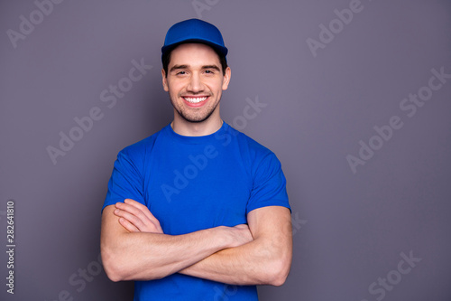 Close up photo express specialist he him his delivery boy strong arms crossed beaming smile self-confident person order offer customer wear blue t-shirt cap corporate suit isolated grey background photo