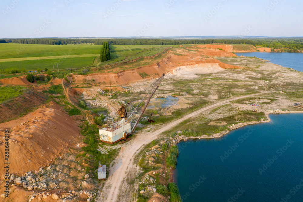 On the site of an abandoned quarry formed a lake. On the site of an abandoned quarry formed a lake.