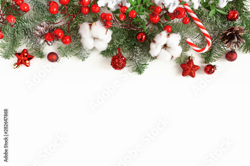 Christmas and New Year holydays composition. Fir tree branches and decor on white background. Flat lay, top view. Copy space