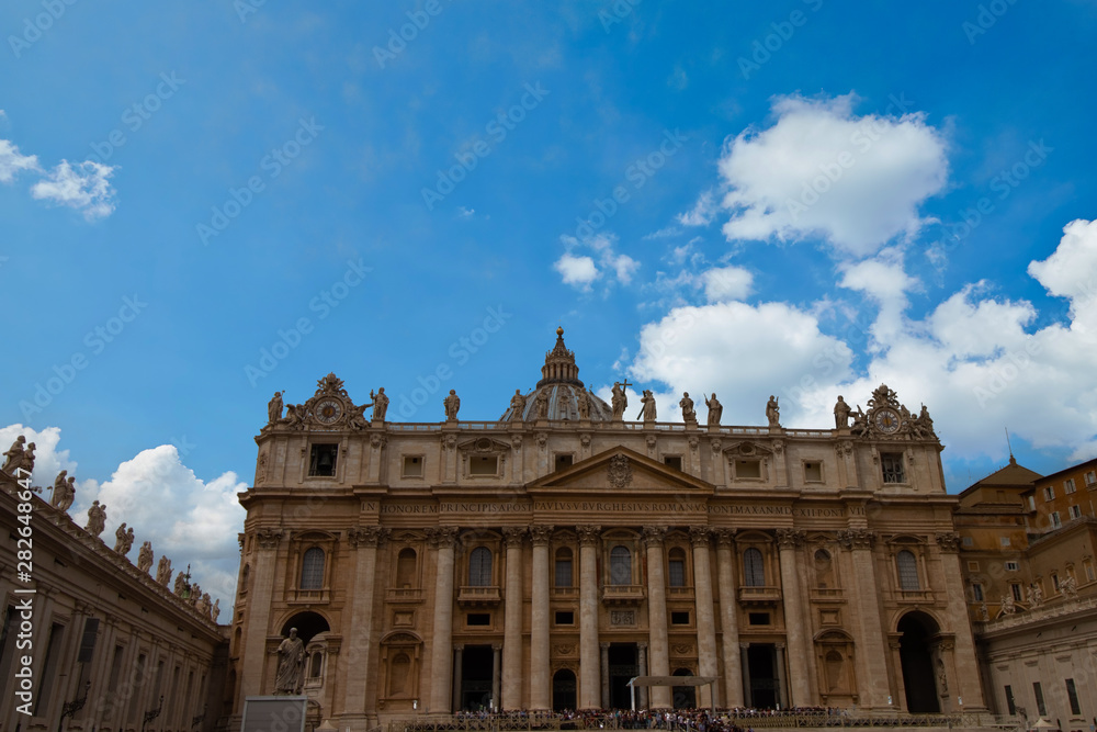 St. Peter's Basilica during the day with a beautiful blue sky in the Vatican