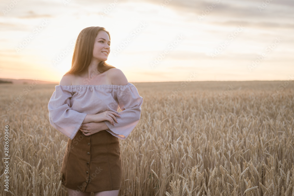 happy beautiful girl in wheat field at sunset happy beautiful girl in wheat field at sunset