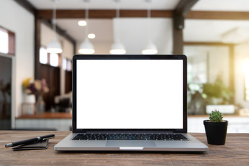 Desk Laptop with blank screen on table of coffee